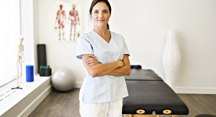 traveling physical therapist smiling at work