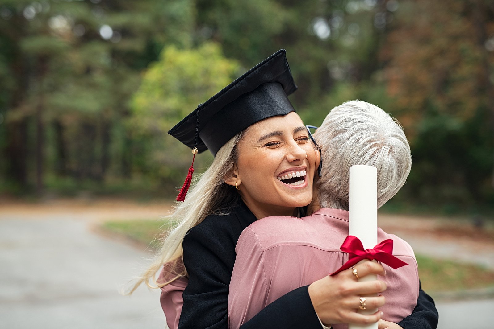 Happy new grad therapist hugging her grandmother