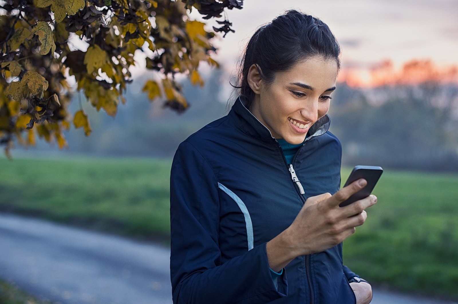 bigstock-Young-athlete-looking-at-phone-206291722