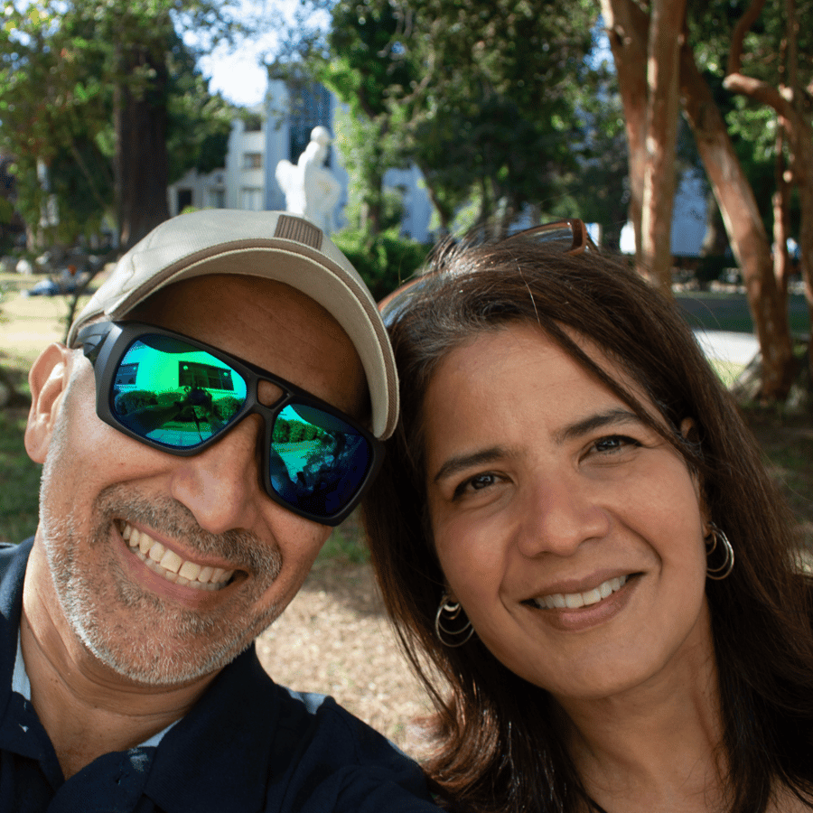 Empty nester couple on a travel therapy assignment taking a selfie while exploring the city