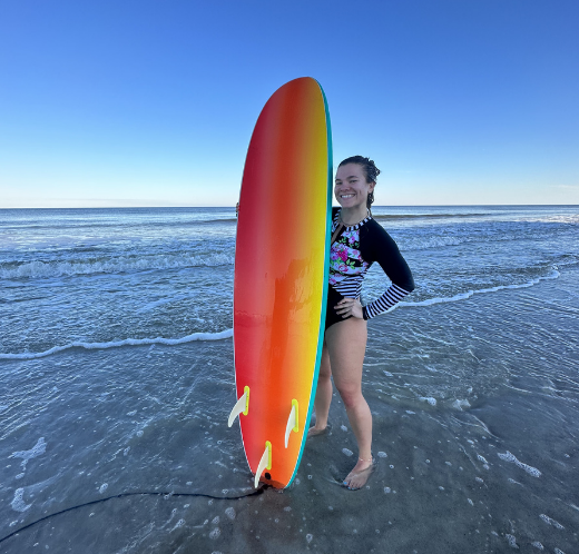 Woman with a surfboard at the beach