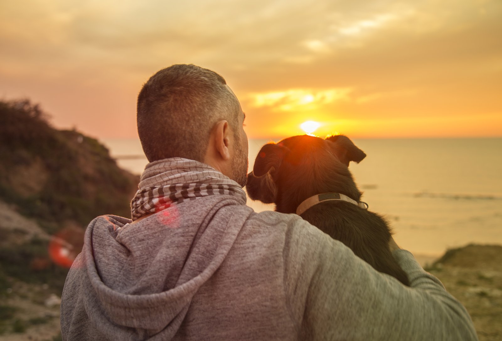 bigstock-Man-And-His-Faithful-Dog-Enjoy-187465465