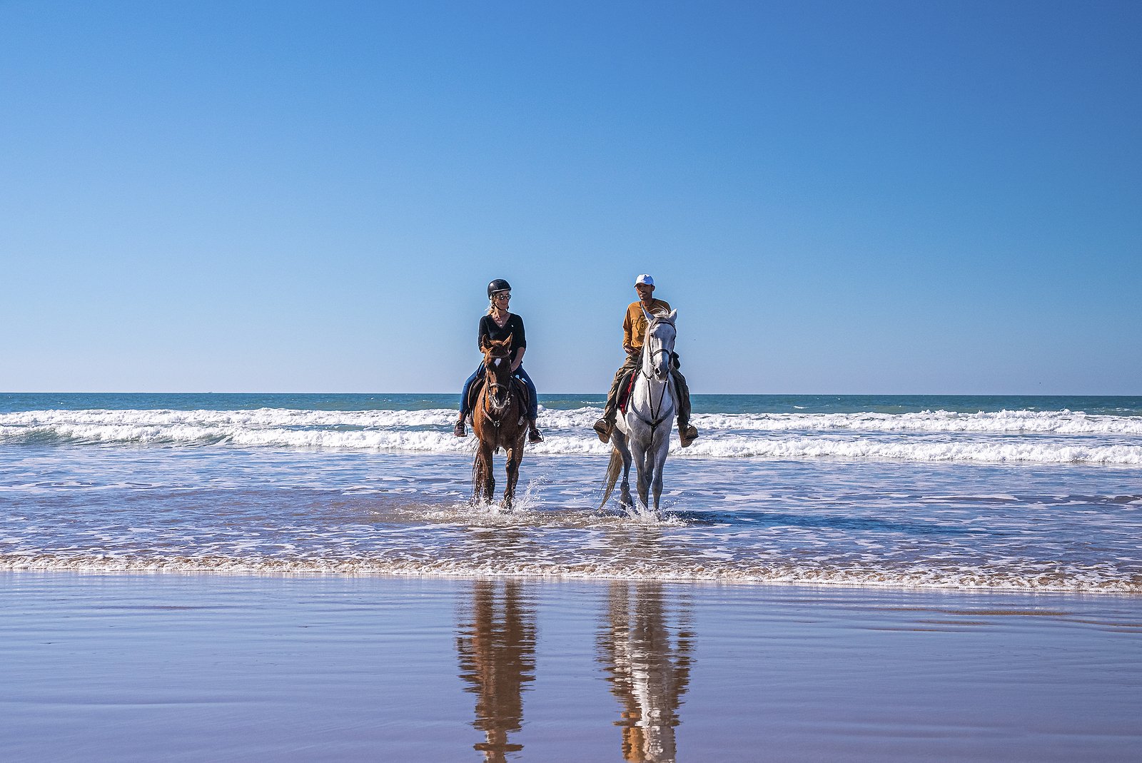 bigstock-Man-And-Woman-Riding-Horses-Al-444083183