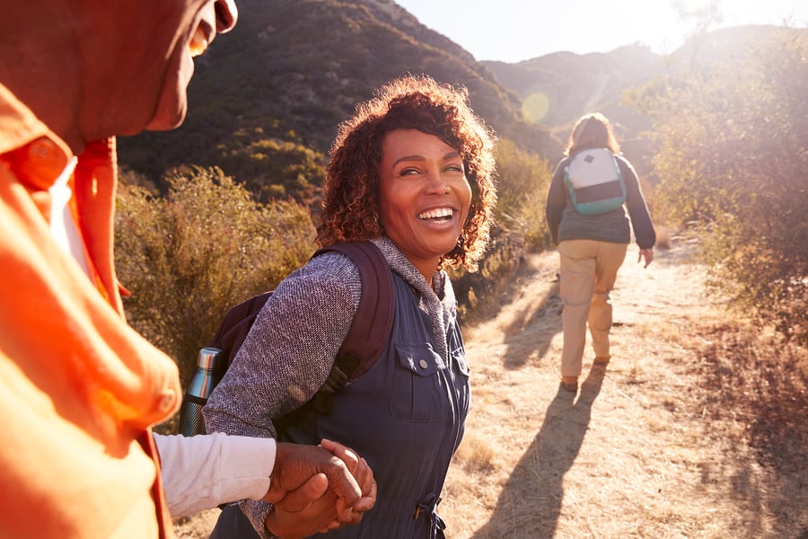 Middle aged travel therapist on a hike on her day off