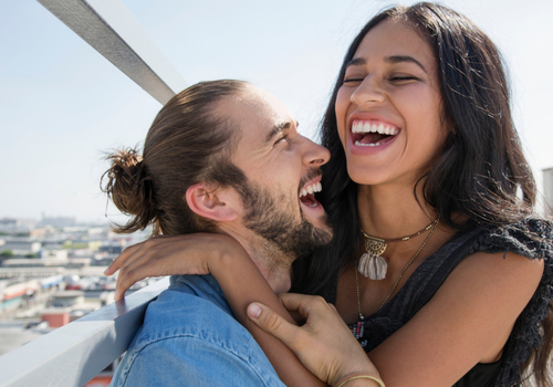 Couple hugging and laughing
