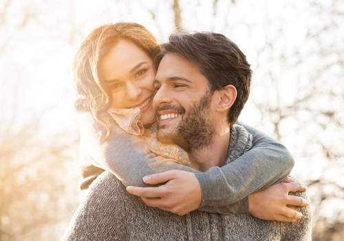 Couple hugging and smiling