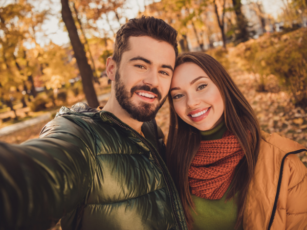 Couple taking a selfie in the woods
