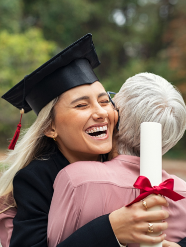 New grad hugging a woman